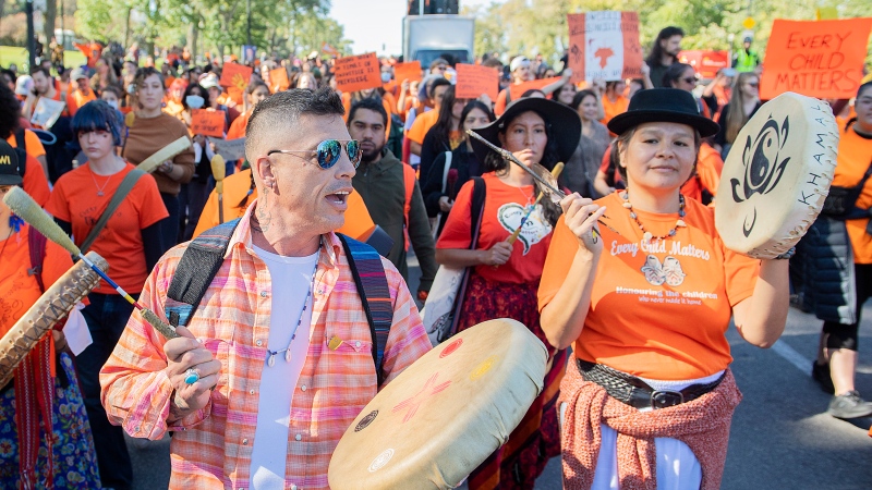 People take part in a march on National Day for Truth and Reconciliation in Montreal, Friday, September 30, 2022. THE CANADIAN PRESS/Graham Hughes