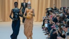 Models with baby bumps wear creations as part of Jean Paul Gaultier's Haute Couture Fall/Winter 2022-2023 fashion collection presented in Paris, Wednesday, July 6, 2022. (AP Photo/Michel Euler)