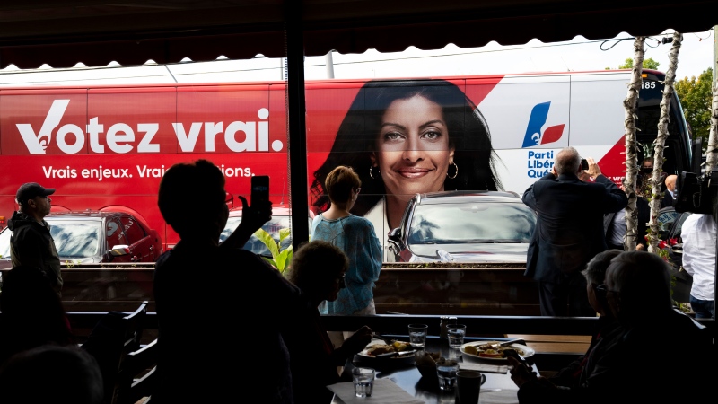 Supporters take pictures of Quebec Liberal Leader Dominique Anglade’s campaign bus as she arrives to a luncheon in Brossard, Que., Thursday, Sept. 29, 2022. THE CANADIAN PRESS/Paul Chiasson