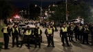 Ottawa police monitor crowds in Sandy Hill on Saturday night, as students celebrate the Panda Game weekend. (Shaun Vardon/CTV News Ottawa)