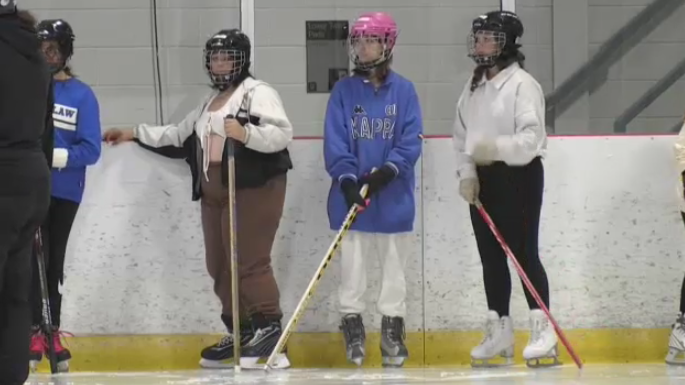 Students play ringette for first time.