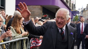 Britain's King Charles III meets the public on a walk after attending an official council meeting at the City Chambers in Dunfermline, Fife, to formally mark the conferral of city status on the former town. (Andrew Milligan/PA via AP)