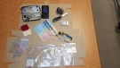 Evidence is displayed after allegedly being seized during an arrest in Gravenhurst, Ont., on Sun., Oct. 2, 2022. (OPP)