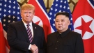 Then-U.S. President Donald Trump shakes hands with North Korea's leader Kim Jong Un before a meeting at the Sofitel Legend Metropole hotel in Hanoi on February 27, 2019. (Saul Loeb/AFP/Getty Images via CNN)