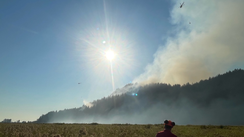 Fire crews battle a blaze at Minnekhada Regional Park in October, 2022. (MVRD Emergency Services/Twitter)