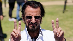 Ringo Starr flashes the peace sign during his annual Peace & Love Birthday Celebration, Thursday, July 7, 2022, in Beverly Hills, Calif. Starr celebrated his 82nd birthday Thursday. (AP Photo/Chris Pizzello)