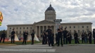 Members of the Winnipeg Police Service are seen standing outside of the Manitoba Legislature on Oct. 3, 2022 (Image source: CTV News Winnipeg)