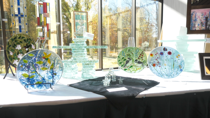 Stained glass panels on display at the 2022 Glassworkers' Guild art show.