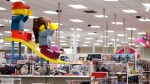  In this Friday, Nov. 16, 2018, file photo photo a display shows two large Lego toys on a slide near the toy section at a Target store in Bridgewater, N.J. The parent company of Toys R Us is turning to a rival to restart its e-commerce business ahead of the holiday shopping season. (AP Photo/Julio Cortez, File)
