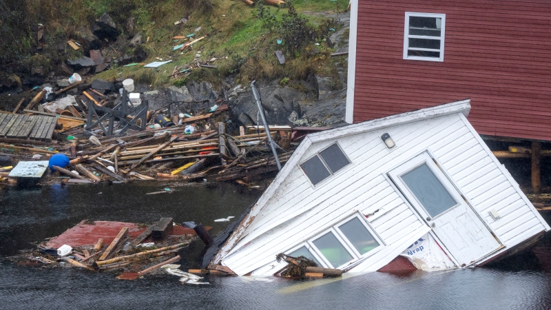 Buildings sit in the water along the shore following hurricane Fiona in Rose Blanche-Harbour Le Cou, Newfoundland on Tuesday September 27, 2022. Fiona left a trail of destruction across much of Atlantic Canada, stretching from Nova Scotia's eastern mainland to Cape Breton, Prince Edward Island and southwestern Newfoundland. (THE CANADIAN PRESS/Frank Gunn)