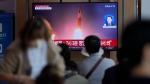 A TV screen showing a news program reporting on a North Korea missile launch with file imagery is seen at the Seoul Railway Station in Seoul, South Korea, Oct. 1, 2022. (AP Photo/Lee Jin-man)
