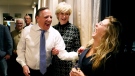 Coalition Avenir Quebec Leader Francois Legault laughs with a supporter as results roll in at the party’s election night headquarters, in Quebec City, Monday, Oct. 3, 2022. THE CANADIAN PRESS/Paul Chiasson