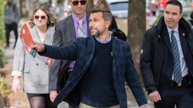 Quebec Solidaire co-spokesperson Gabriel Nadeau-Dubois smiles as he tours the riding of Saint-Henri/Sainte-Anne during an election campaign stop in Montreal, Saturday, October 1, 2022. Quebecers will go to the polls on October 3rd. THE CANADIAN PRESS/Graham Hughes