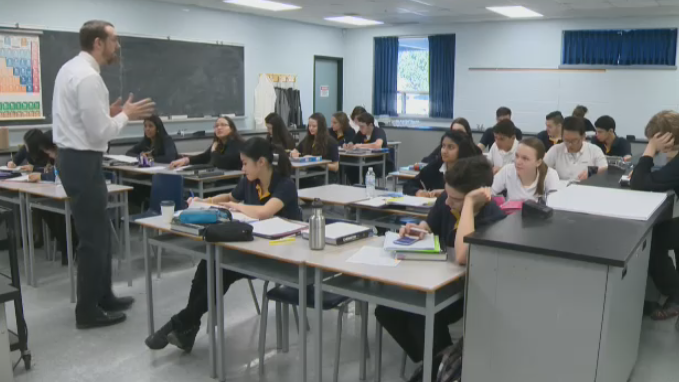A teacher stands in front of a classroom. (TV News Kitchener)