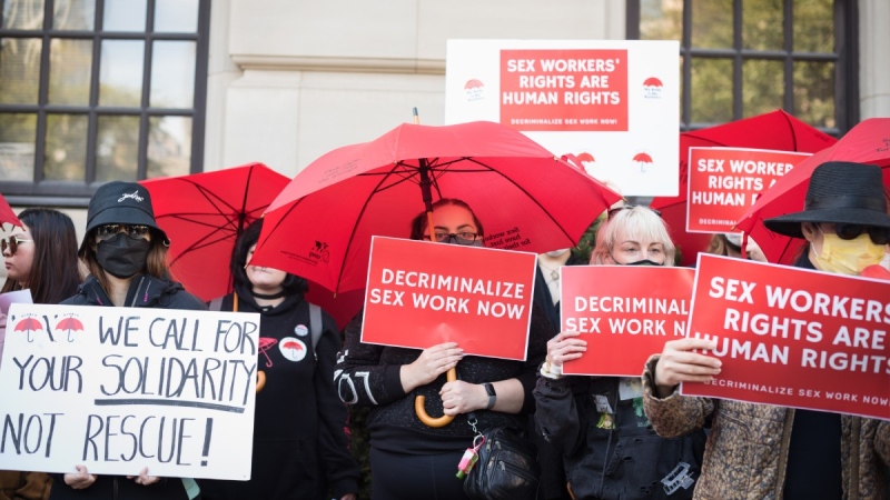 Sex workers and their supporters gather outside the Ontario Superior Court during the launch of their constitutional challenge to Canada's sex work laws, Oct. 3, 2022. THE CANADIAN PRESS/ Tijana Martin
