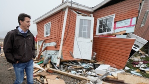 Prime Minister Justin Trudeau tours the damage caused by post-tropical storm Fiona in Port aux Basques, N.L. on Wednesday, Sept. 28, 2022. THE CANADIAN PRESS/Frank Gunn