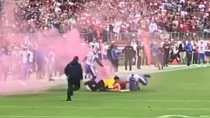 NFL linebacker tackles protester on field