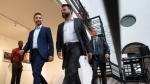 Quebec Solidaire co-spokesperson Gabriel Nadeau-Dubois, left, arrives at a news conference with local candidate Haroun Bouazzi while campaigning Tuesday, August 30, 2022 in Montreal. Quebec votes in the provincial election Oct. 3, 2022. THE CANADIAN PRESS/Ryan Remiorz