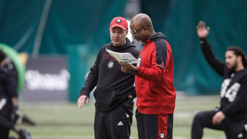 Ottawa Redblacks head coach Rick Campbell and Specialist Teams Coordinator Bob Dyce talk during practice, in preparation for Grey Cup, in Edmonton, Wednesday, Nov. 21, 2018. (Jason Franson/THE CANADIAN PRESS)