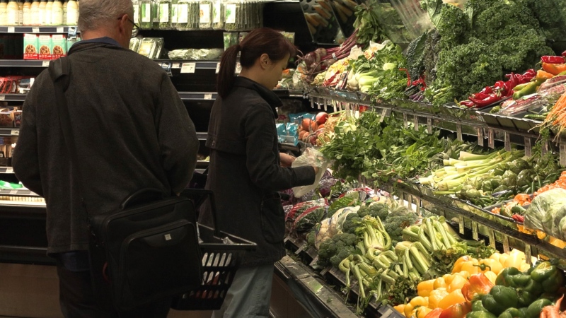 Shoppers are seen at the Quality Foods in View Royal, B.C., on Oct. 4, 2022. (CTV News)