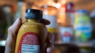 A bottle of prepared mustard condiment past its best-before date is shown in Toronto. THE CANADIAN PRESS/Graeme Roy