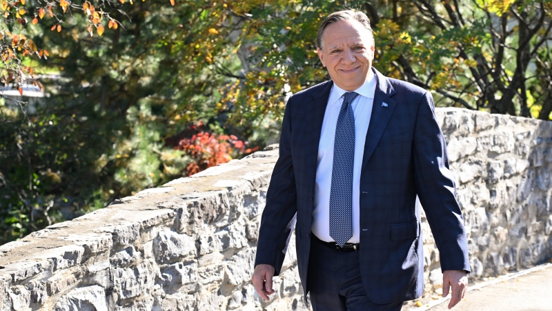 Quebec Premier and Coalition Avenir Quebec Leader Francois Legault walks to a news conference Tuesday, October 4, 2022 in Saint-Francois on the Ile dOrleans. THE CANADIAN PRESS/Jacques Boissinot