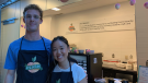 Tina Hu (right) stands with a volunteer at the PEACH Market at Queen's University, which has been set up to help students suffering from food insecurities. (Kimberley Johnson/CTV News Ottawa)