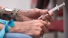A person injects hydromorphone at the Providence Health Care Crosstown Clinic in the Downtown Eastside of Vancouver, B.C., on Wednesday April 6, 2016. Ontario's doctors have reached a deal with the province over how much addictions doctors will be paid for virtual care after the physicians raised an outcry over previously planned changes would have put 30,000 patients at risk of losing lifesaving opioid treatments, The Canadian Press has learned.  THE CANADIAN PRESS/Darryl Dyck