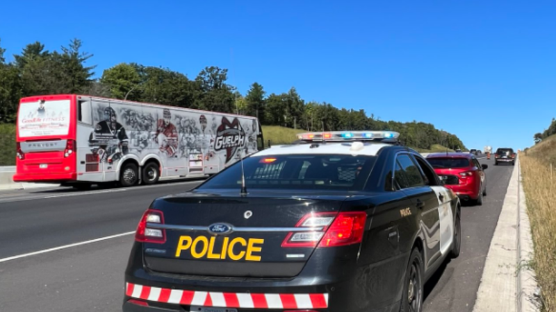 An Ontario Provincial Police officer pulls a vehicle over along Highway 400 - File Image. (OPP/Twitter)