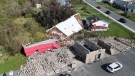 The roof of a car wash which was blown on to a neighbouring house in Glace Bay, N.S. is shown in a handout photo released Monday, Sept.26, 2022. THE CANADIAN PRESS/HO-Communications Nova Scotia