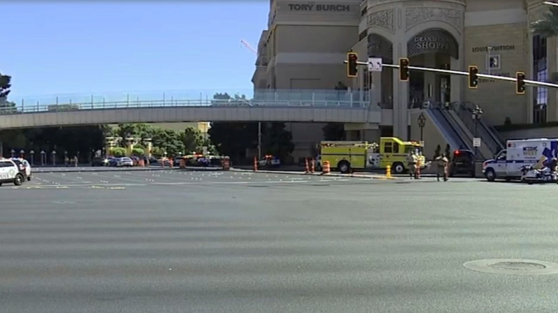 Emergency personnel respond the scene of a stabbing along the Las Vegas Strip on Thursday, Oct. 6, 2022. Police say one person has been fatally stabbed and at least five others wounded. A suspect is in custody. (KTNV via AP)