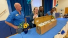 CTV News Ottawa's Stefan Keyes joins staff and former students at W.E. Gowling Public School to open a 1996 time capsule. (Peter Szperling/CTV News Ottawa)