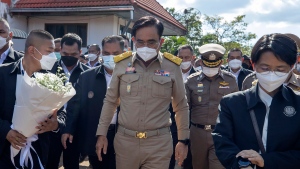 Prime Minister Prayuth Chan-ocha arrives to meet with the families of the victims in the Thursday day care attack in Uthai Sawan, north eastern Thailand, Friday, Oct. 7, 2022. (AP Photo/Wason Wanichakorn)
