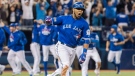 Toronto Blue Jays' Edwin Encarnacion celebrates after hitting a walk-off three-run home run during 11th inning American League wild-card game action against the Baltimore Orioles in Toronto, Tuesday, Oct. 4, 2016. THE CANADIAN PRESS/Mark Blinch