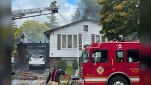 Emergency crews respond to a house fire on Blue Forest Drive in London on Oct. 7, 2022. (Gerry Dewan/CTV News London)