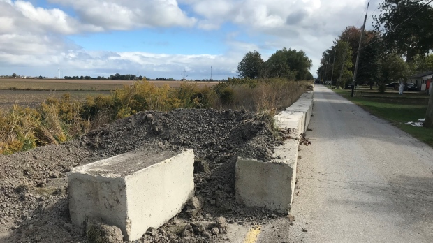 Work is underway to restore two-way traffic on Erie Shore Drive in Chatham-Kent, Ont. on Friday, Oct. 7, 2022. (Michelle Maluske/CTV Windsor)