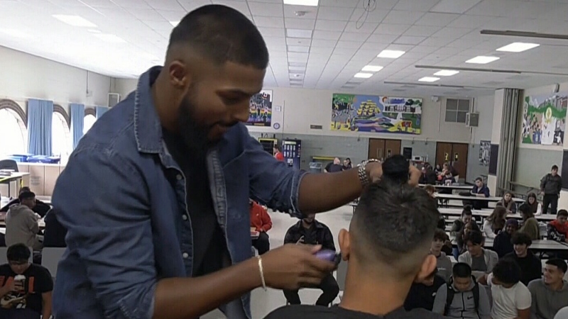 Kennedy grad returns to give free haircuts 