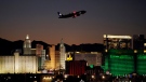 A plane takes off from McCarran International Airport near casinos along the Las Vegas Strip, Wednesday, Sept. 29, 2021, in Las Vegas.(AP Photo/John Locher)