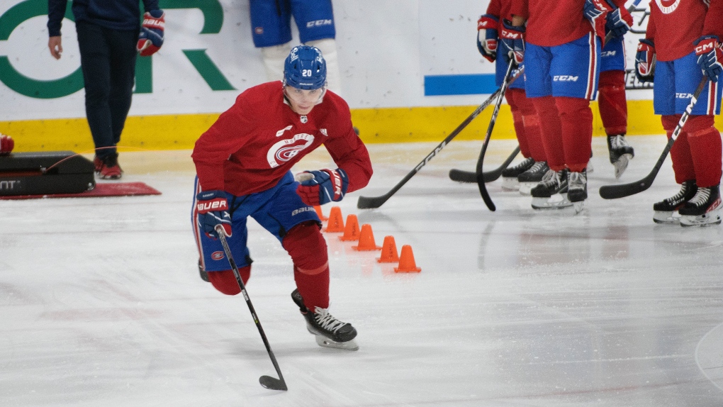 Canadiens' Juraj Slafkovsky happily pays his part of rookie dinner