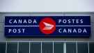 The Canada Post logo is seen on the outside the company's Pacific Processing Centre, in Richmond, B.C., on June 1, 2017. Canada Post is now offering loans alongside stamps and packaging as it officially launches a partnership with TD Bank Group.( THE CANADIAN PRESS/Darryl Dyck)