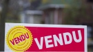 A sold sign is shown on the west island of Montreal, Saturday, November 4, 2017. THE CANADIAN PRESS/Graham Hughes