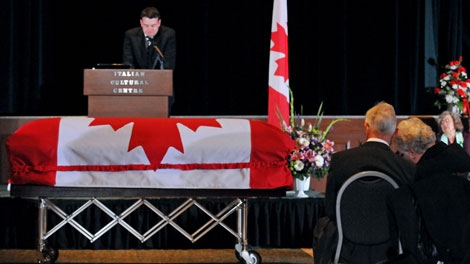 Michelle Lang's parents Art and Sandra Lang, bottom right, listen as their son Cameron Lang speaks during funeral services in Vancouver, B.C., on Monday, Jan. 11, 2010. (Vancouver Province-Les Bazso, Pool / THE CANADIAN PRESS)