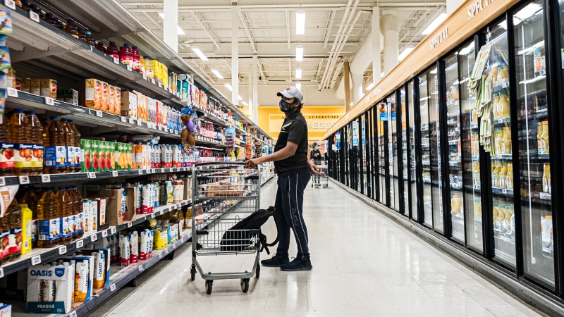 People wearing masks shop at a grocery store in Moncton, N.B., on Wednesday, September, 22, 2021. THE CANADIAN PRESS/Christopher Katsarov