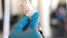 A nurse loads a syringe with the Moderna COVID-19 vaccine at an inoculation station next to Jackson State University in Jackson, Miss., Tuesday, July 19, 2022. (AP / Rogelio V. Solis)