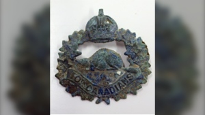 A cap badge found with the remains of Pte. Harry Atherton, who died on Aug. 15, 1917, during the Battle of Hill 70 near Lens, France. The Department of National Defence and Canadian Armed Forces announced Oct. 28, 2022, that Atherton's remains, recovered more than five years earlier, had been identified. (Department of National Defence)