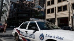 A police cruiser is parked in front of the Toronto Police Services headquarters, in Toronto, on Friday, August 9, 2019. THE CANADIAN PRESS/Christopher Katsarov