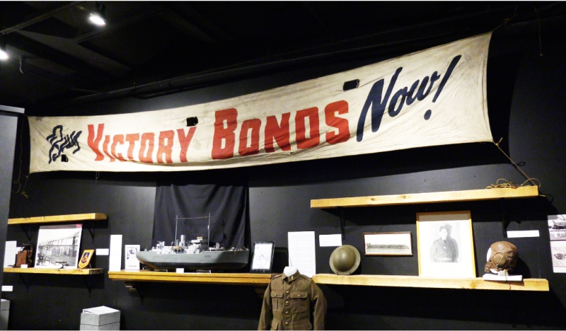 In honour of Remembrance Day, the Timmins Museum: National Exhibition Centre has set up a display of items from various wars, including a banner advertising Victory Bonds that was hung across a local street. (Lydia Chubak, CTV News)