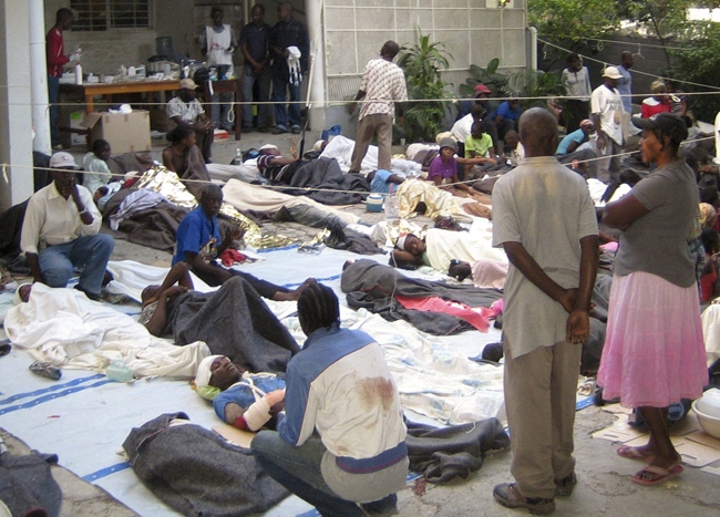 This photo provided by Medecins Sans Frontieres (Doctors Without Borders) shows wounded people gathered at the office of Medecins Sans Frontieres in Port-au-Prince, Haiti, Wednesday, Jan. 13, 2010.