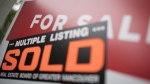 A real estate sign is pictured in Vancouver, B.C., Tuesday, June, 12, 2018. (THE CANADIAN PRESS Jonathan Hayward)