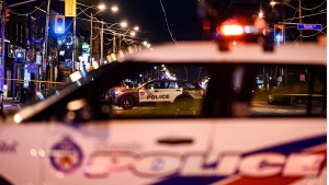 Police attend the scene of a collision in the west end of Toronto on Thurs., March 31, 2022. THE CANADIAN PRESS/Christopher Katsarov